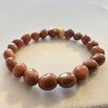 Goldfluss – handgefertigtes Reiki-Trommelsteinarmband +/- 6–8 mm